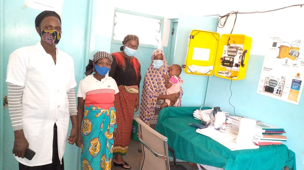 Nurse Cristina Kaunda Quilossa, far left, says the solar suitcase makes delivering babies much easier and safer.