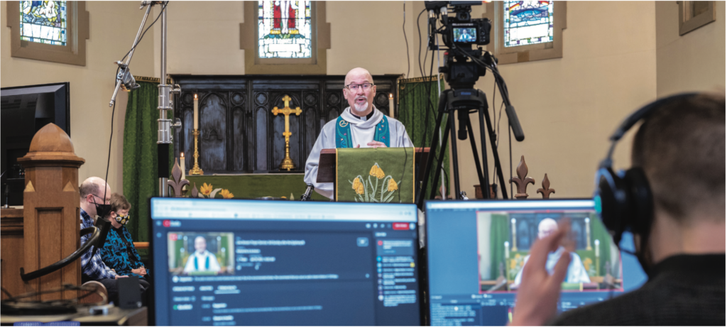 The Rev Canon Chris Harwood-Jones leads onLine service. Photograph and text from All Saints, Vernon Facebook page.