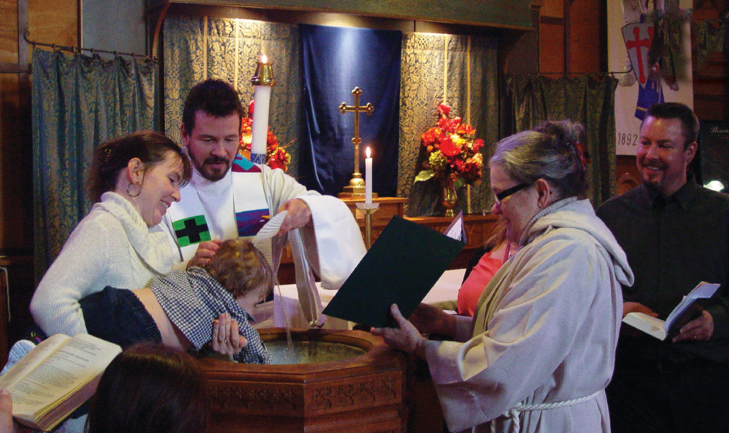 (2016) St Michael and All Angel’s, Balfour BC. The Rev Jeff D onnel ly and lay minister Micahel Lavender preside at a child baptism. Photograph: John Lavender